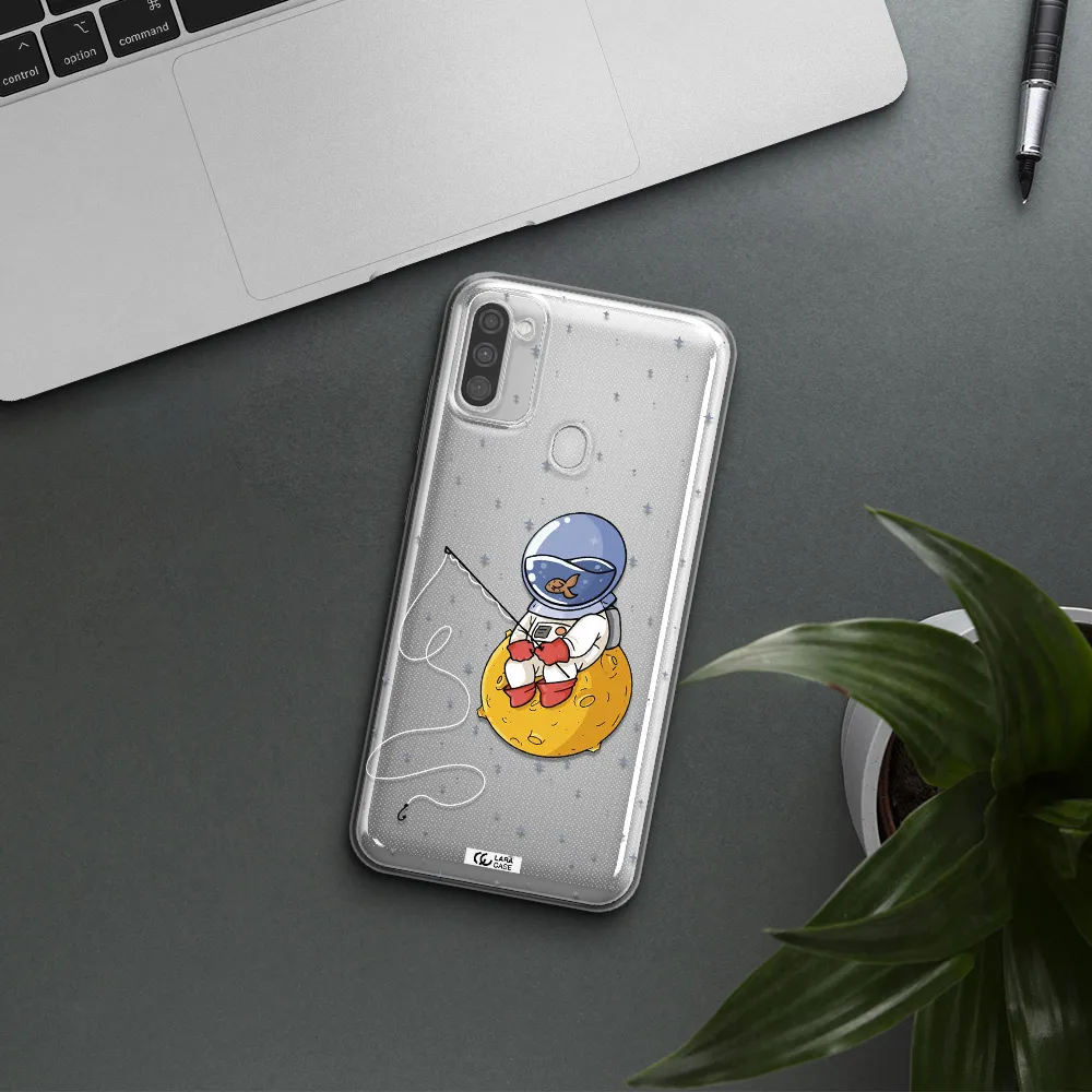 a cartoon of an astronaut sitting on a moon Samsung M11 Clear TPU Case