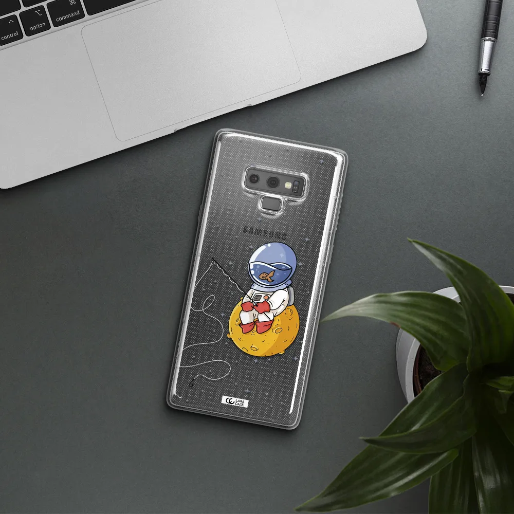 a cartoon of an astronaut sitting on a moon Samsung Note 9 Clear TPU Case