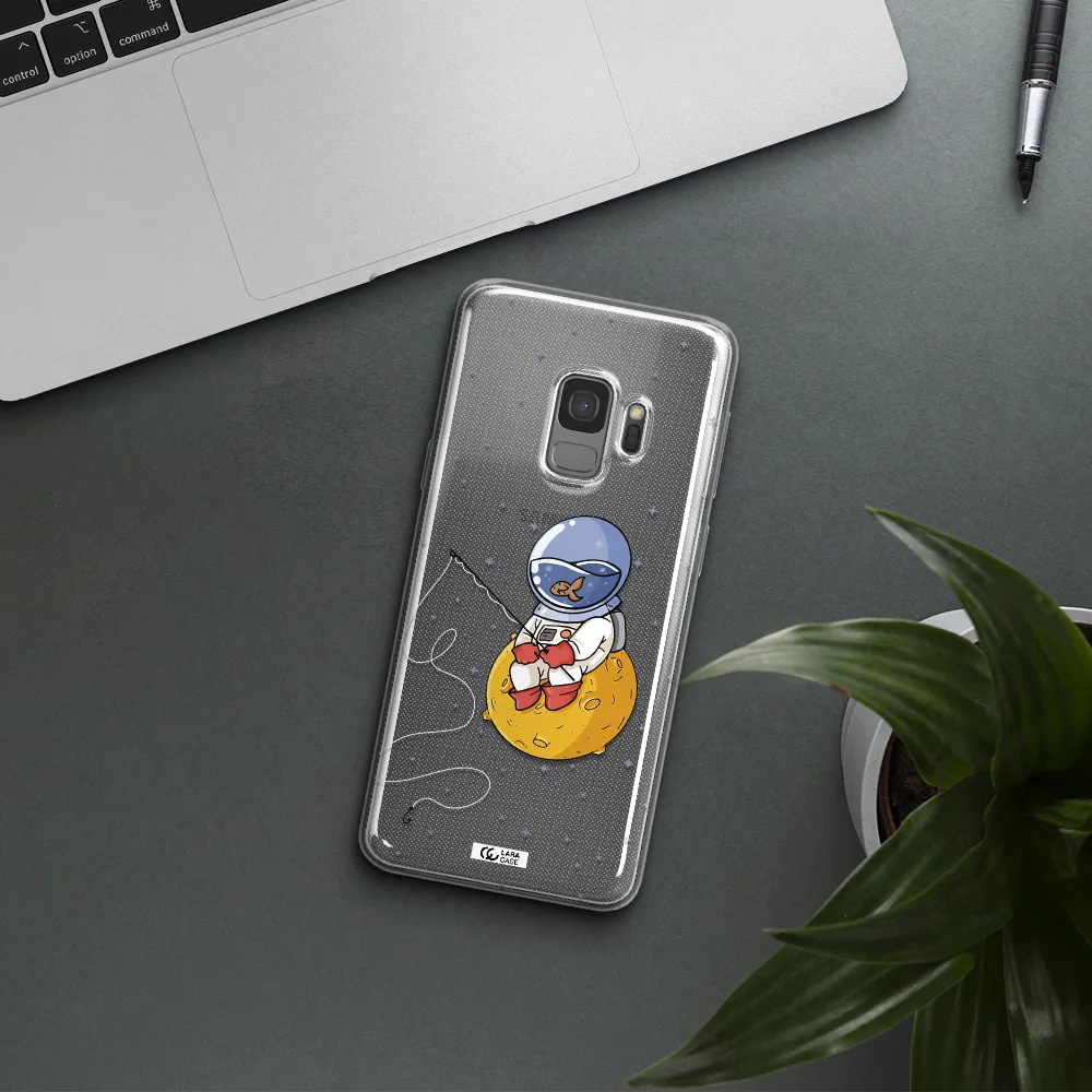 a cartoon of an astronaut sitting on a moon Samsung S9 Clear TPU Case