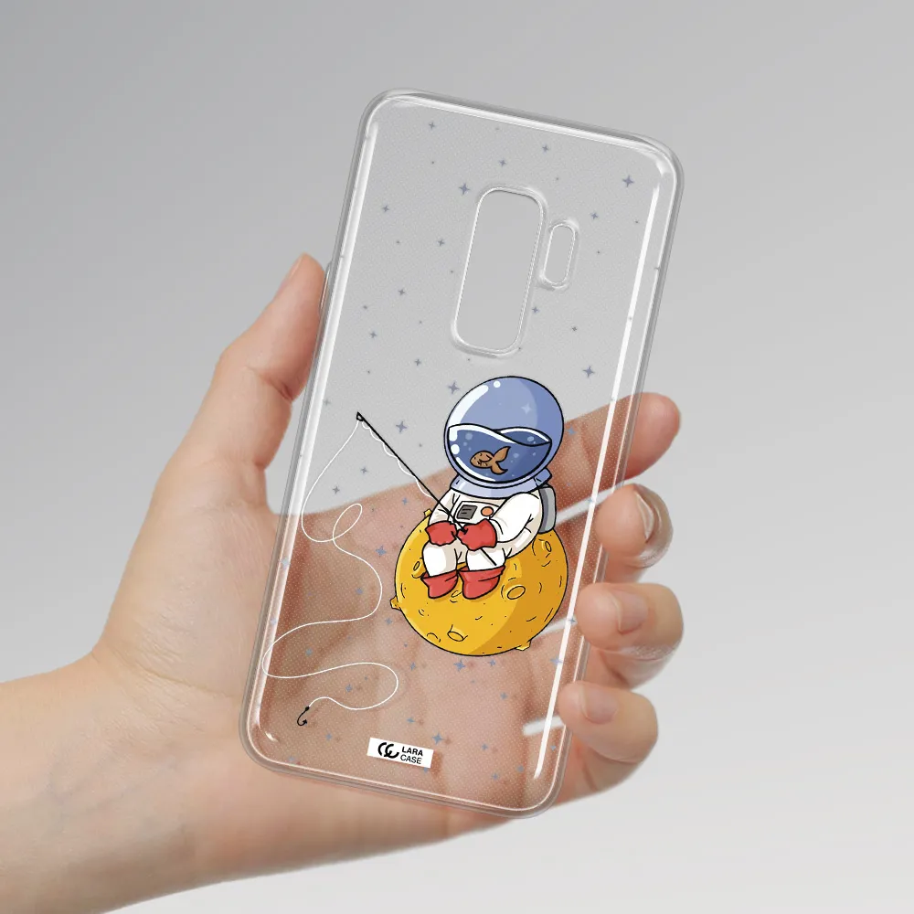 a cartoon of an astronaut sitting on a moon Samsung S9 Plus Clear TPU Case