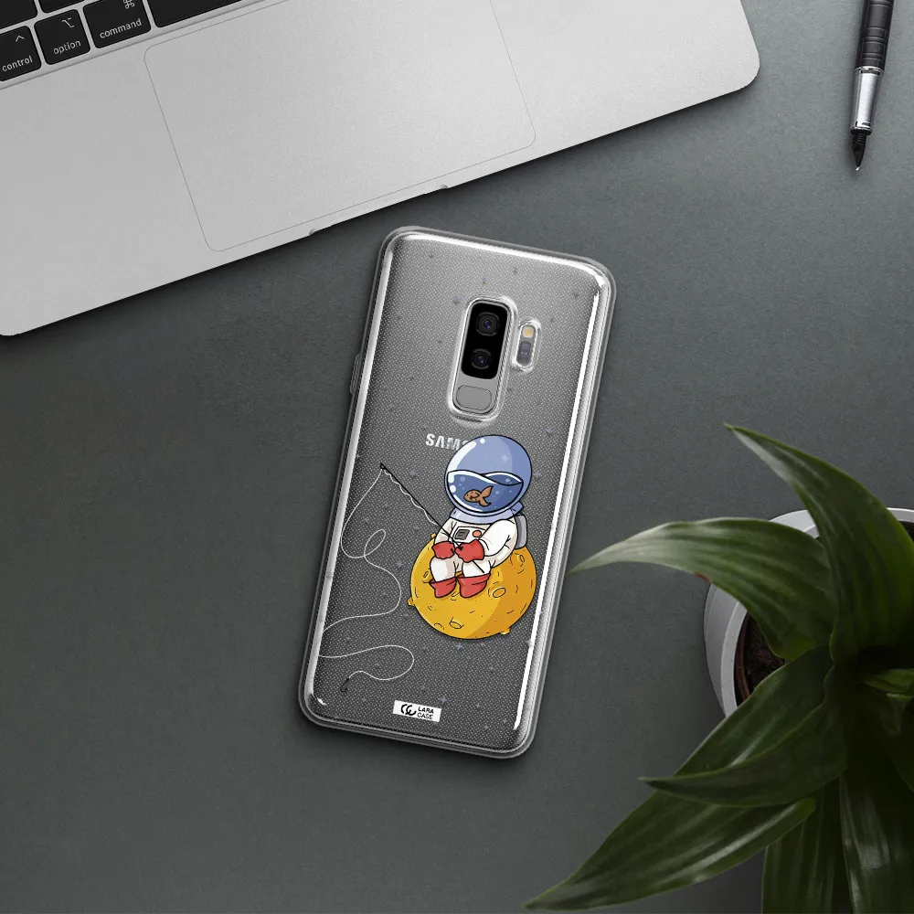 a cartoon of an astronaut sitting on a moon Samsung S9 Plus Clear TPU Case