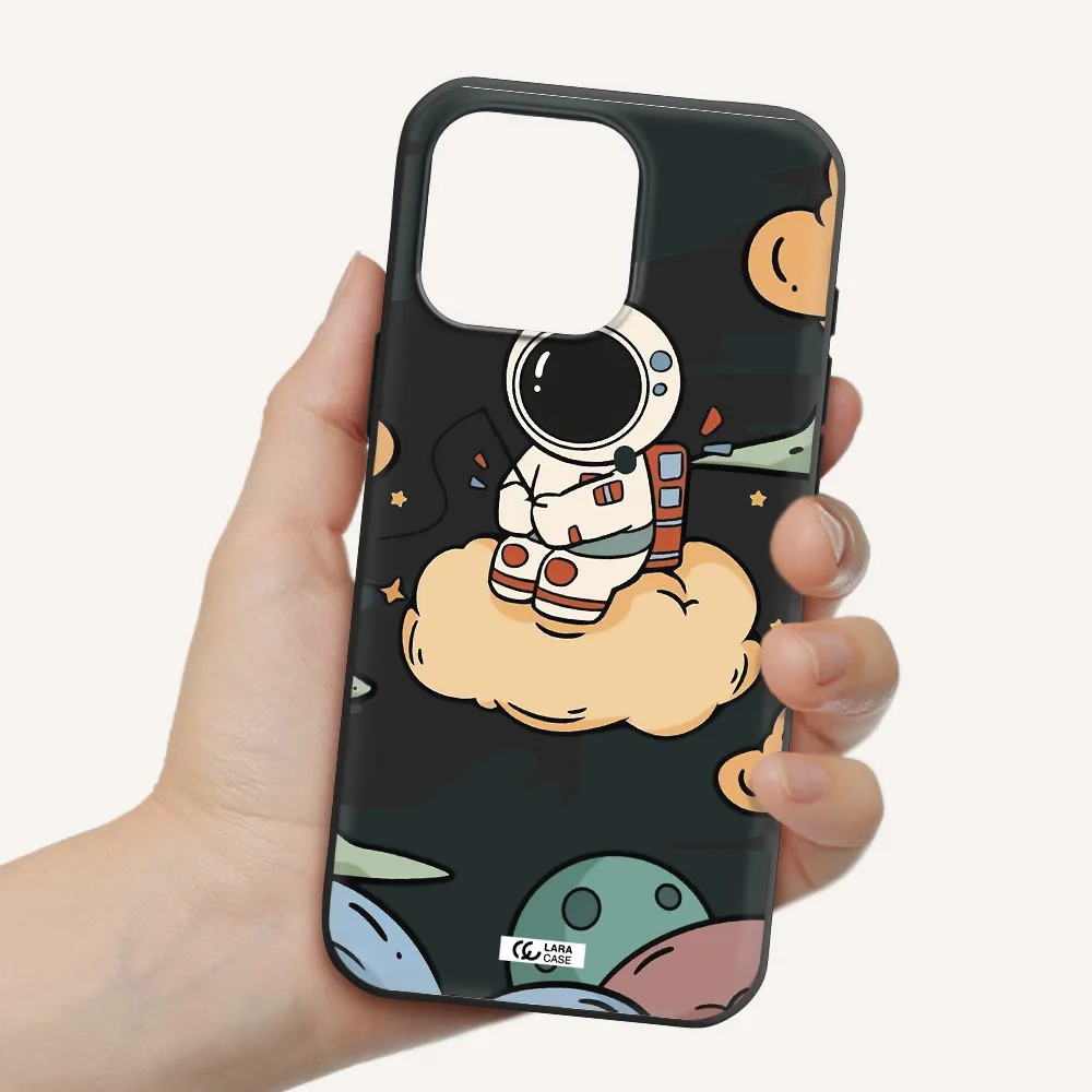 A Cartoon Astronaut Sitting On A Cloud Apple Iphone 16 Pro Max Silicone Black Case