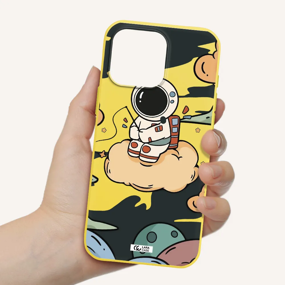 A Cartoon Astronaut Sitting On A Cloud Apple Iphone 16 Pro Max Silicone Canary Yellow Case