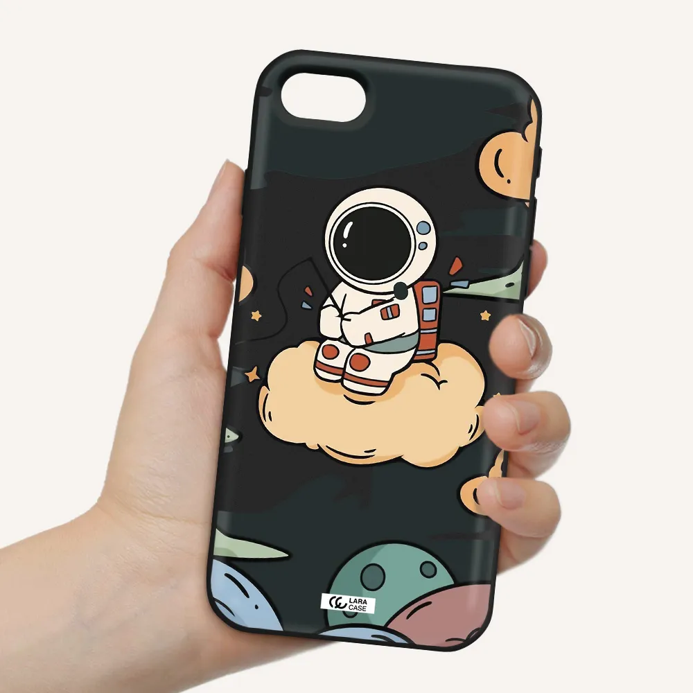 a cartoon astronaut sitting on a cloud Apple iPhone se 2020 Silicone black Case