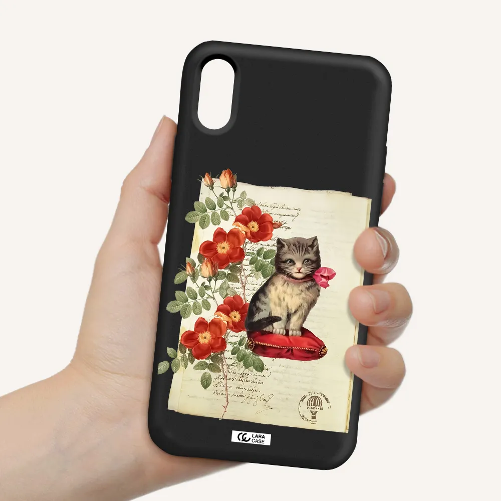a cat on a pillow with flowers Apple iPhone X Silicone black Case