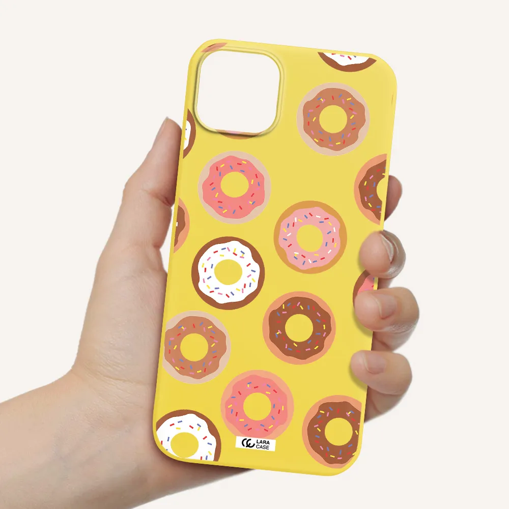 a pattern of donuts with sprinkles Apple iPhone 14 Silicone canary yellow Case