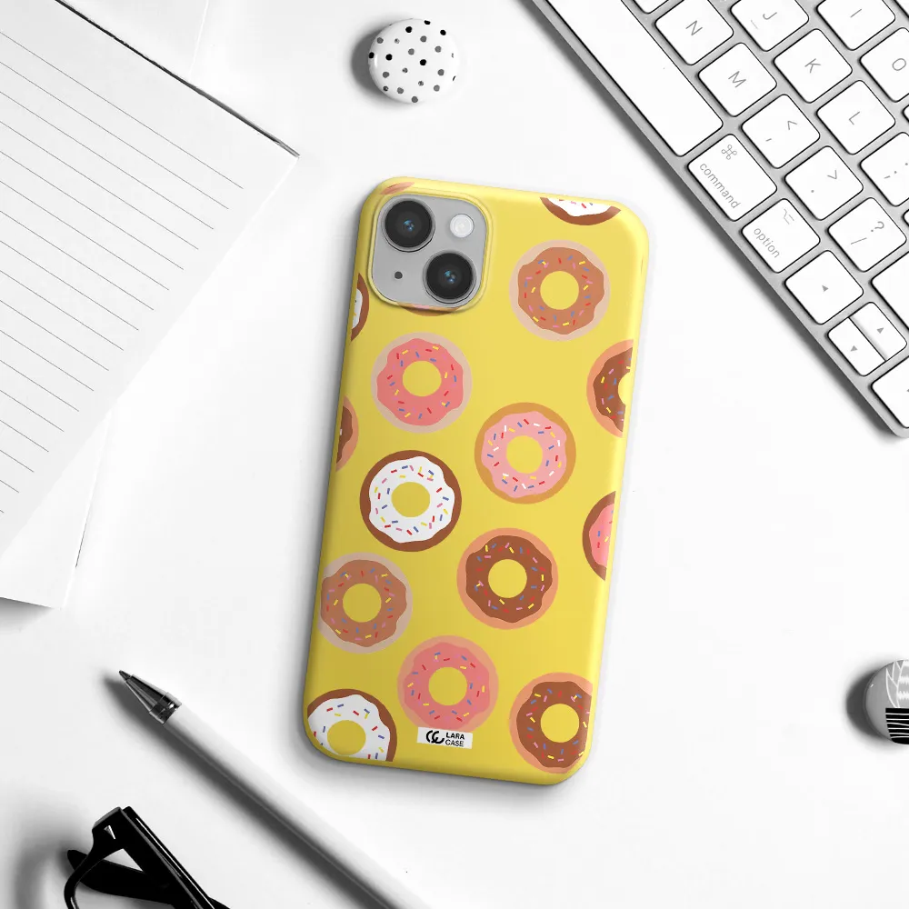 a pattern of donuts with sprinkles Apple iPhone 14 Silicone canary yellow Case
