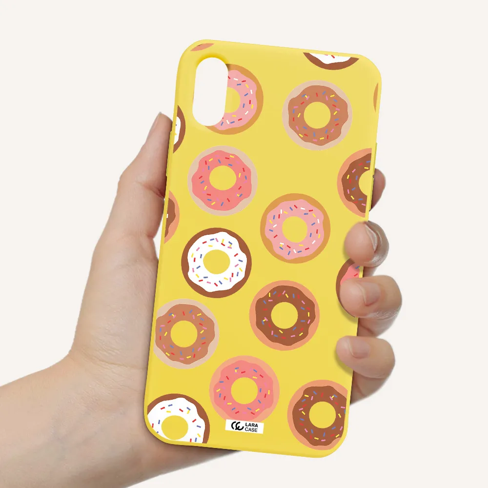 a pattern of donuts with sprinkles Apple iPhone XS Silicone canary yellow Case