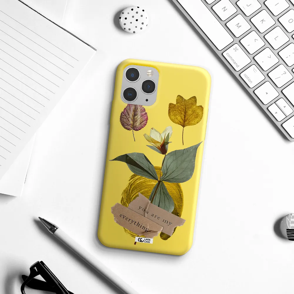 a flower with leaves and a box Apple iPhone 11 pro Silicone canary yellow Case