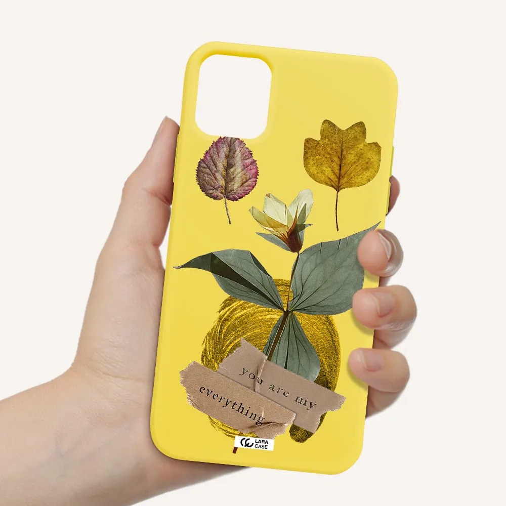 a flower with leaves and a box Apple iPhone 11 Silicone canary yellow Case