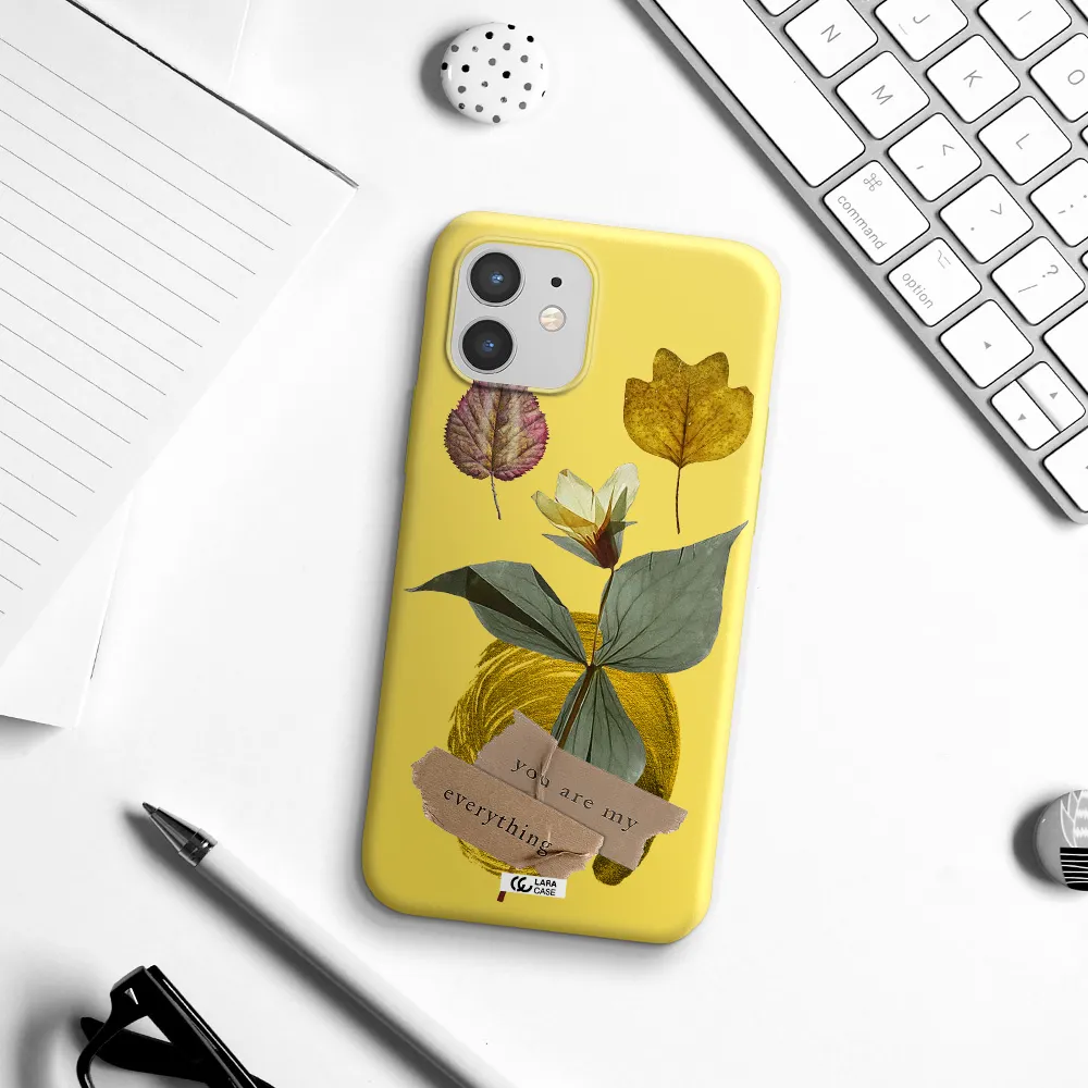 a flower with leaves and a box Apple iPhone 12 mini Silicone canary yellow Case