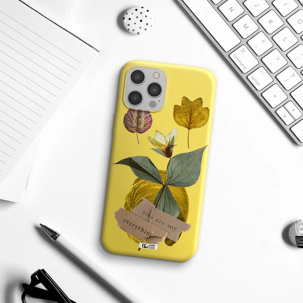 a flower with leaves and a box Apple iPhone 12 pro Silicone canary yellow Case