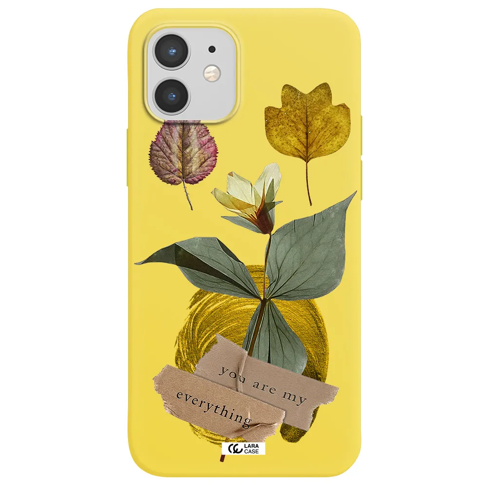 a flower with leaves and a box Apple iPhone 12 Silicone canary yellow Case