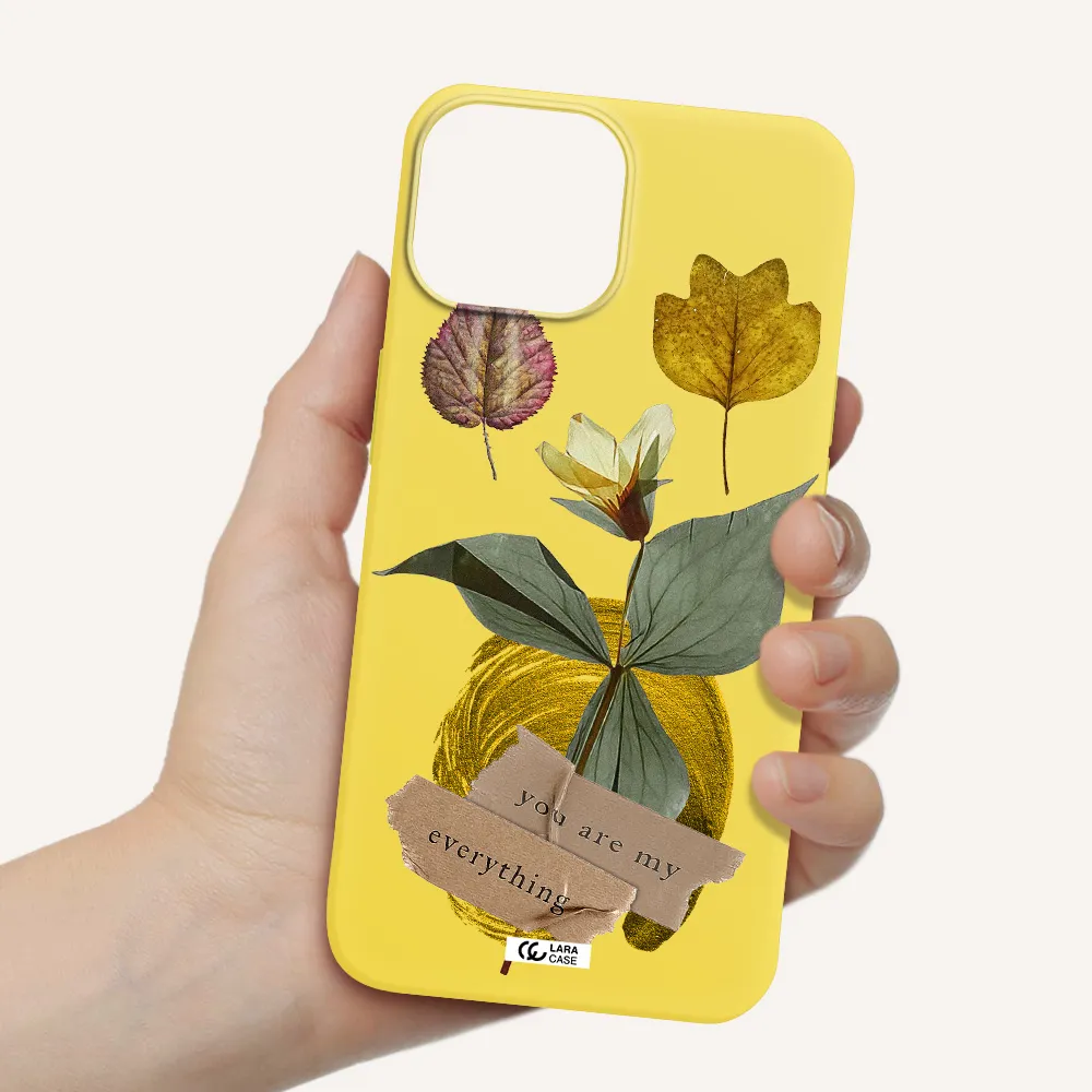 a flower with leaves and a box Apple iPhone 13 mini Silicone canary yellow Case