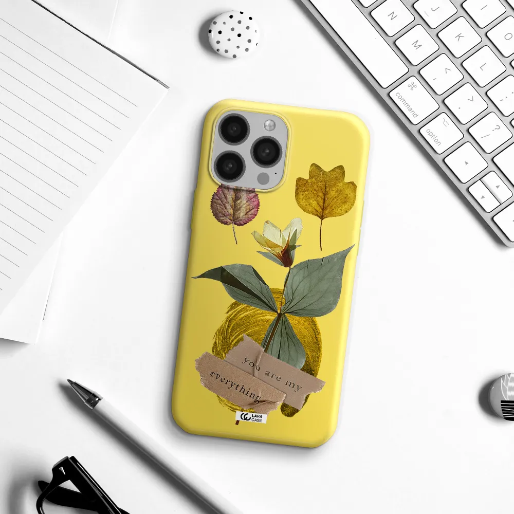 a flower with leaves and a box Apple iPhone 13 Pro Max Silicone canary yellow Case
