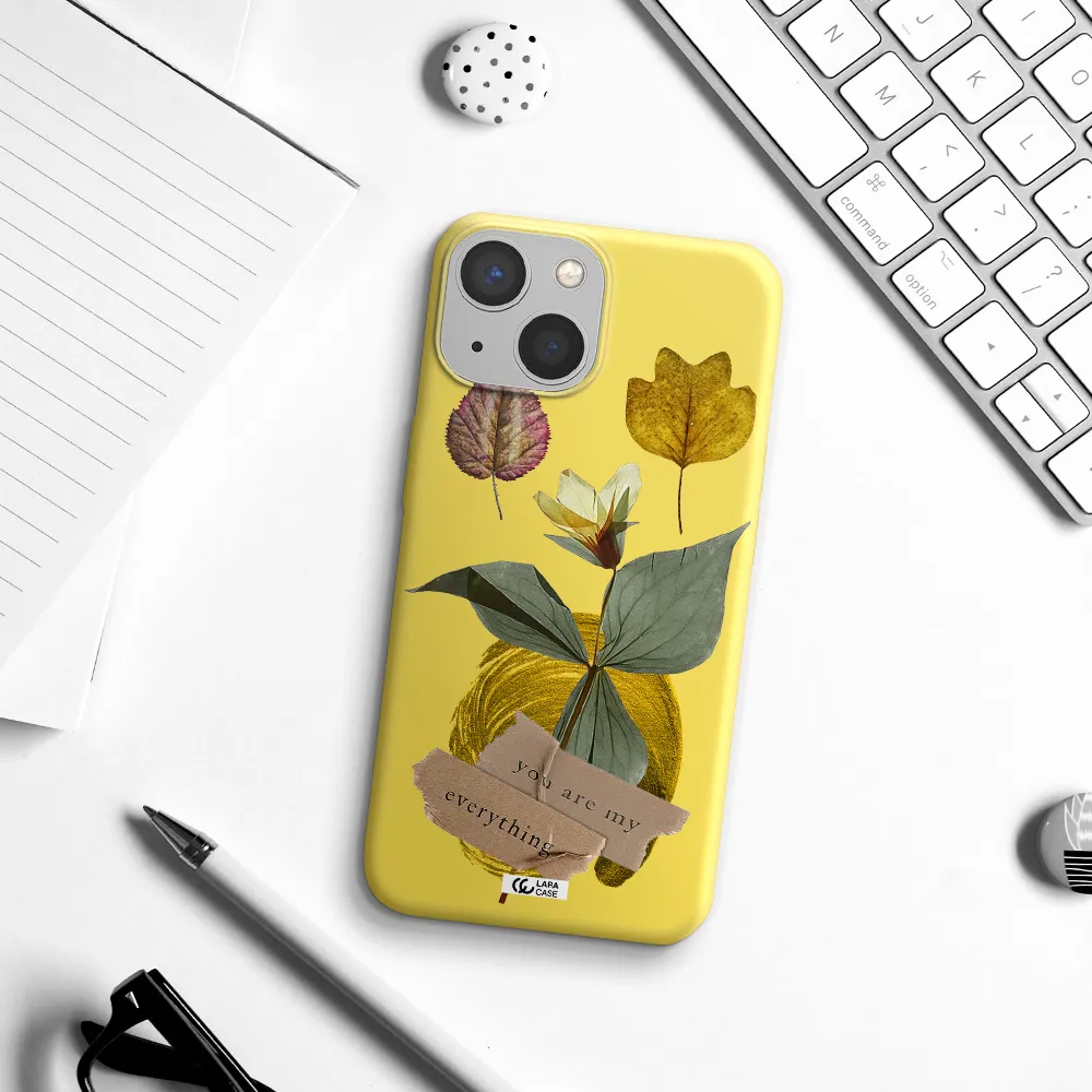 a flower with leaves and a box Apple iPhone 13 Silicone canary yellow Case