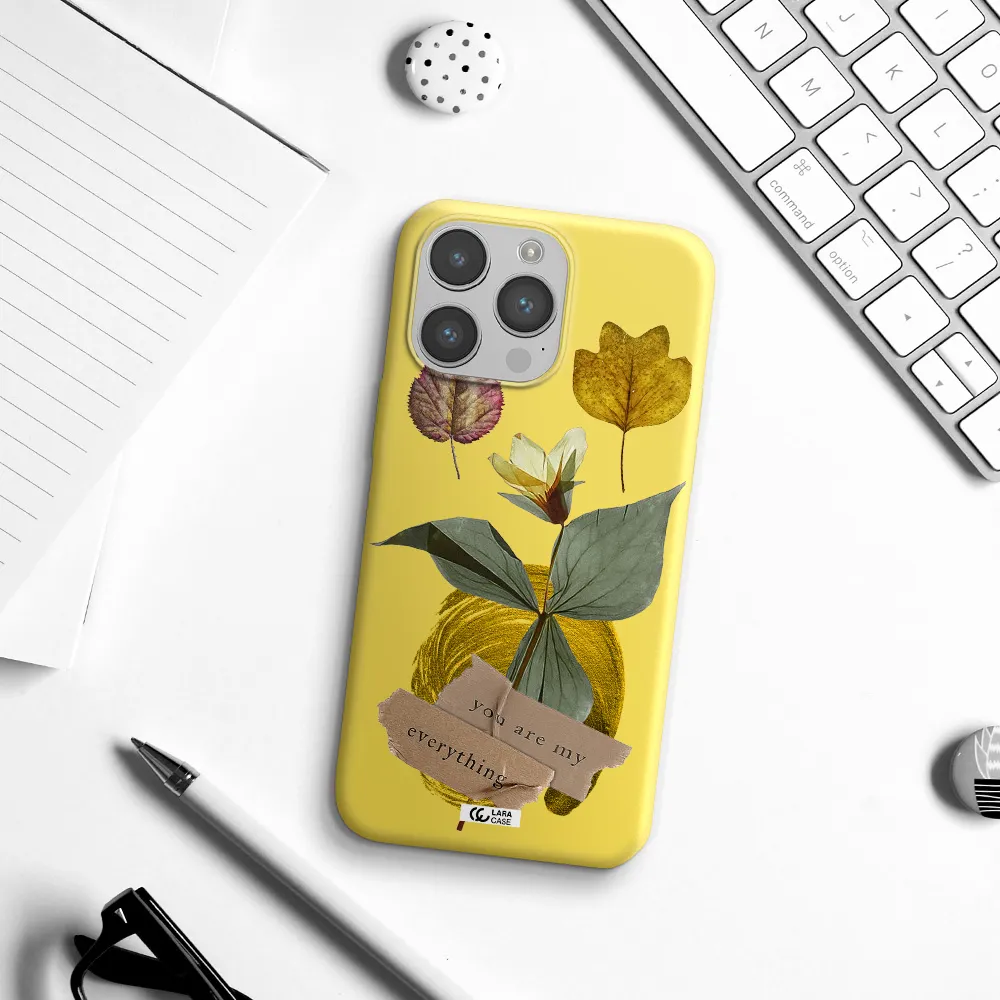 a flower with leaves and a box Apple iPhone 14 pro max Silicone canary yellow Case