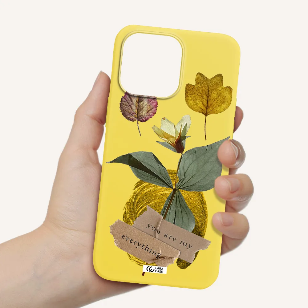 a flower with leaves and a box Apple iPhone 14 pro Silicone canary yellow Case