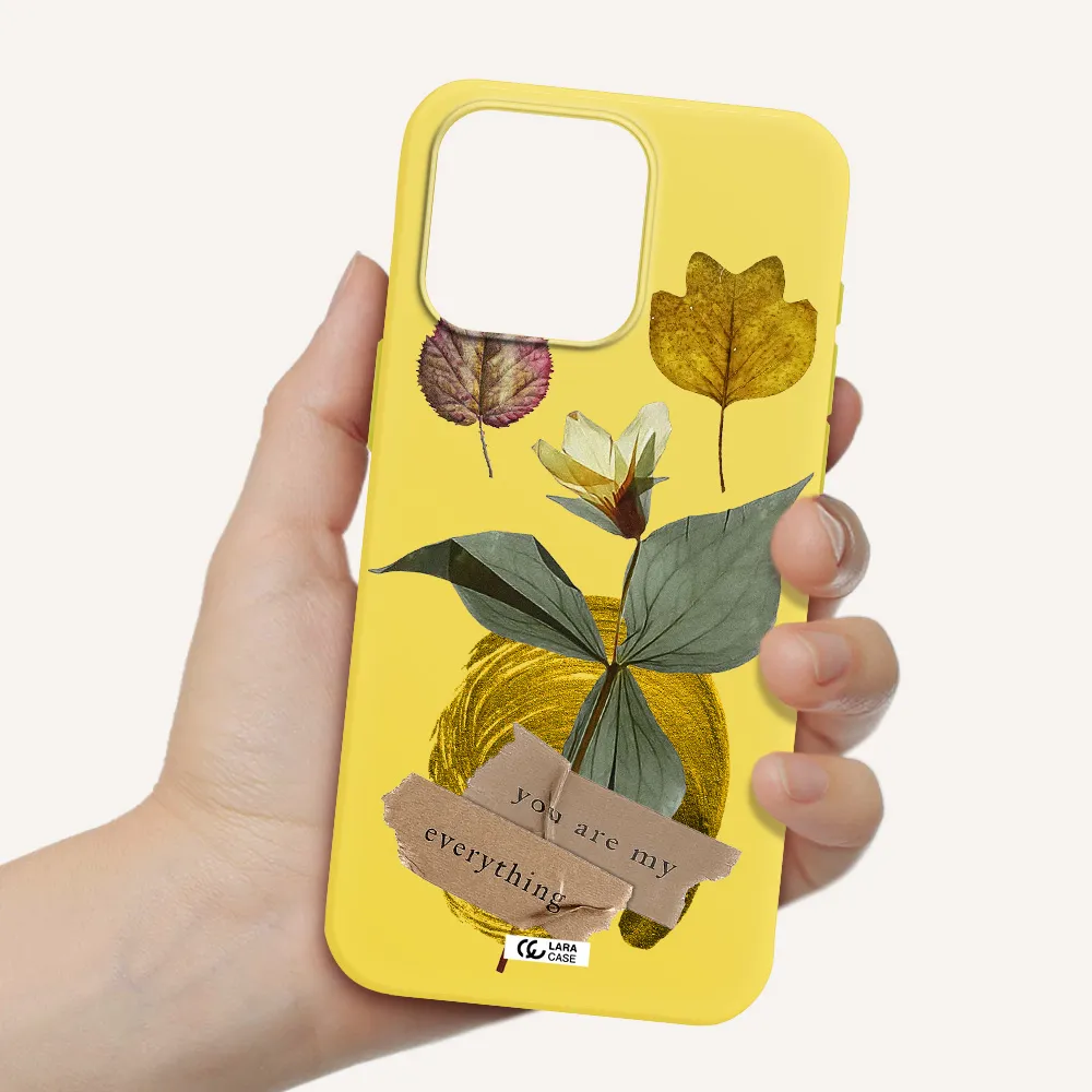 a flower with leaves and a box Apple Iphone 15 Pro max Silicone canary yellow Case