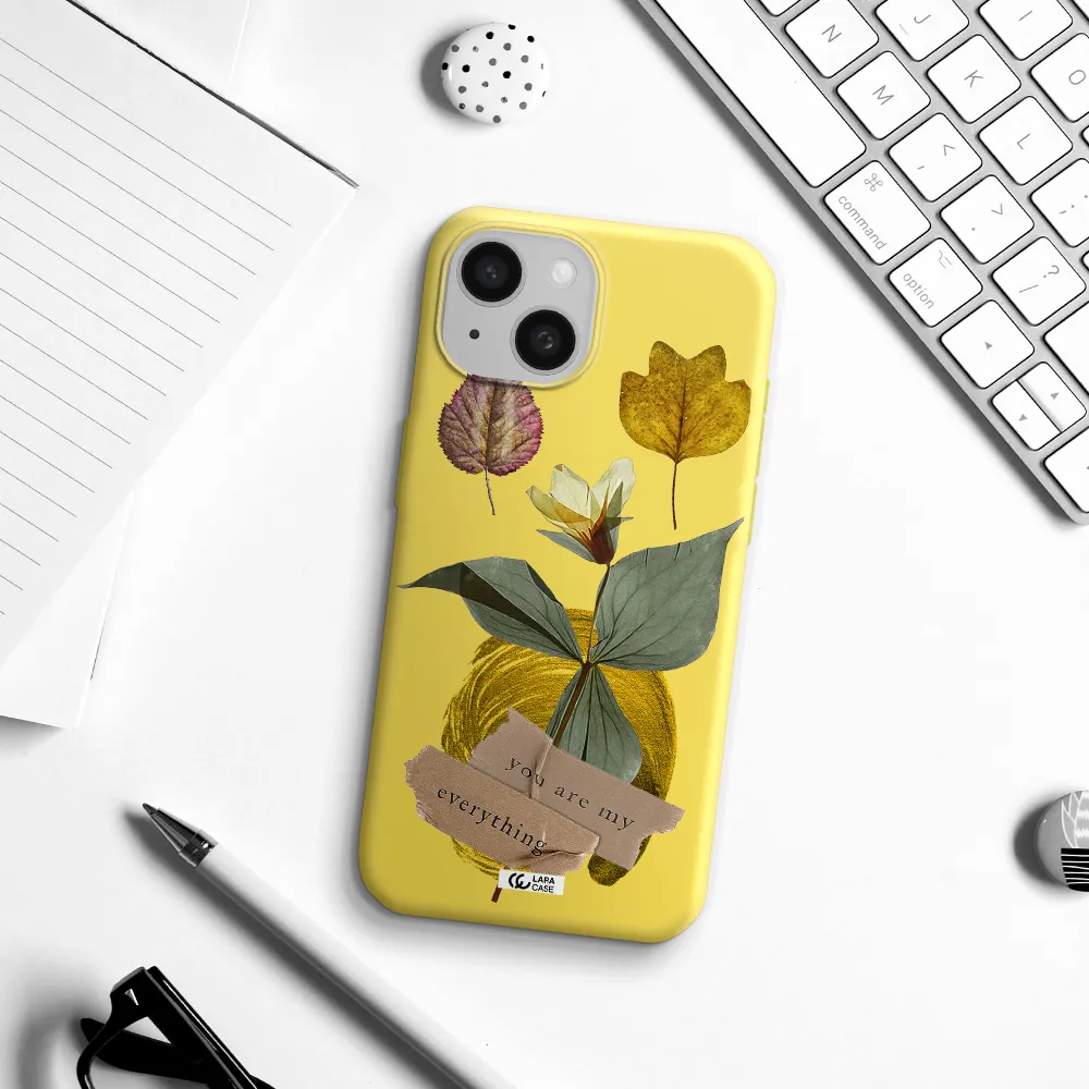 a flower with leaves and a box Apple iPhone 15 Silicone canary yellow Case