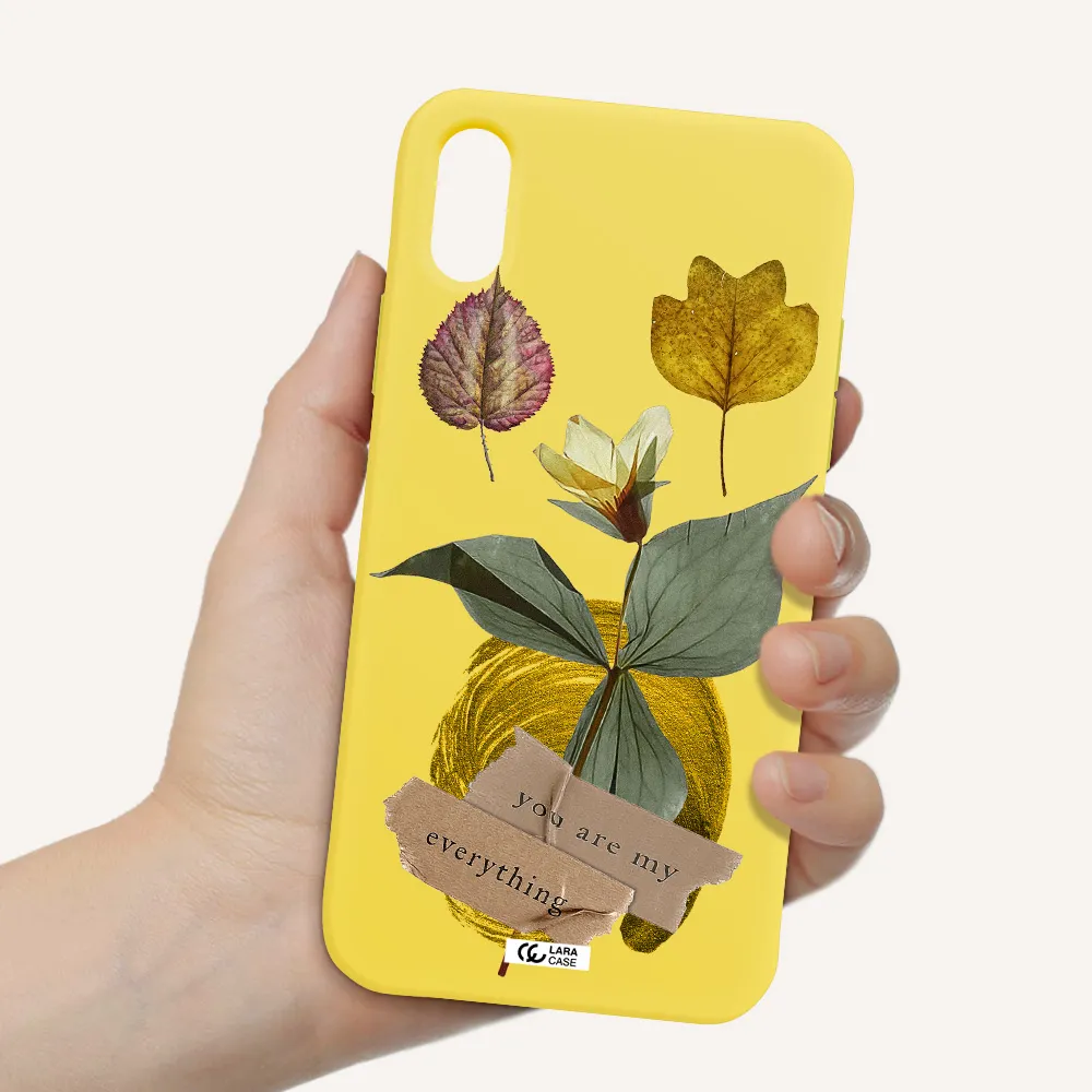 a flower with leaves and a box Apple iPhone X Silicone canary yellow Case