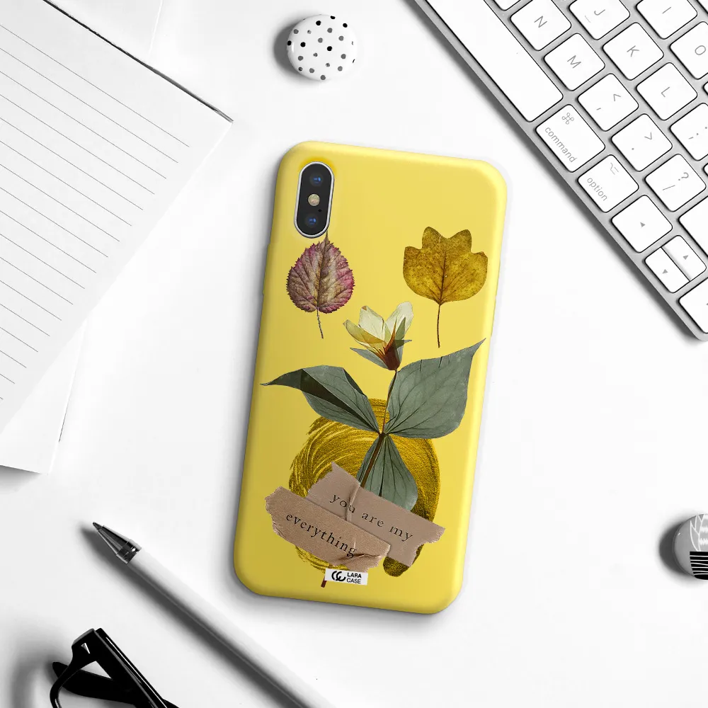 a flower with leaves and a box Apple iPhone X Silicone canary yellow Case