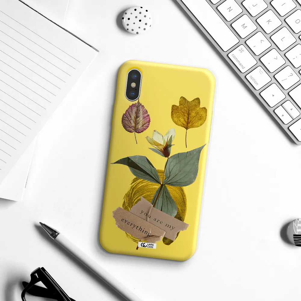 a flower with leaves and a box Apple iPhone XS Silicone canary yellow Case
