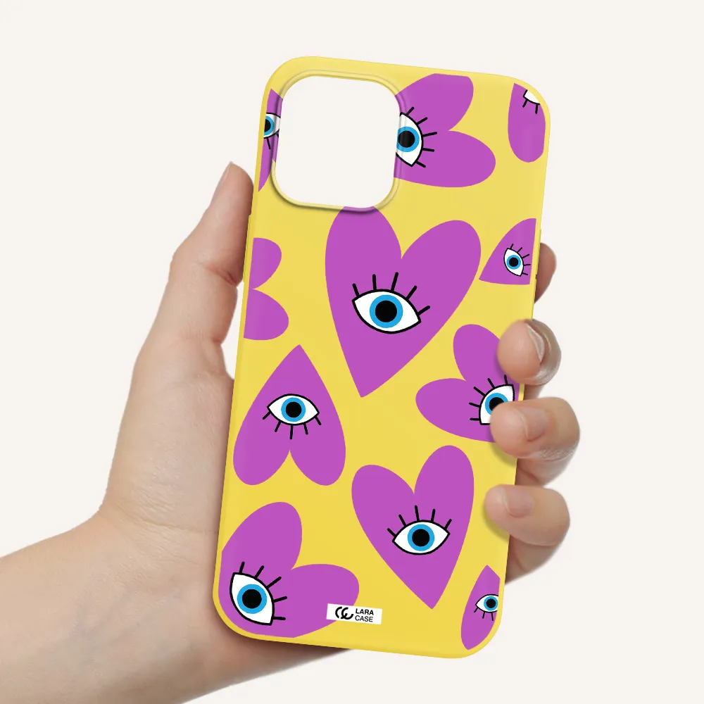 a purple heart with eyes and a black eye Apple iPhone 12 pro max Silicone canary yellow Case