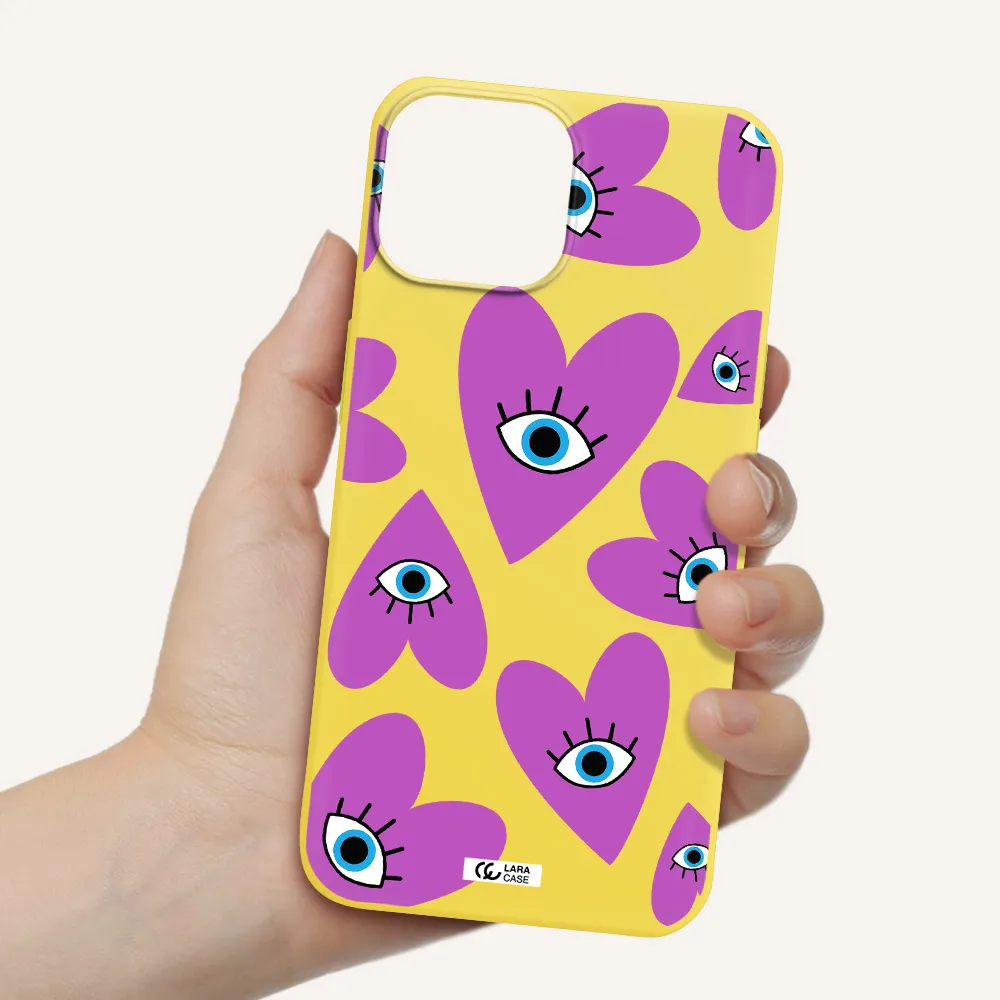 a purple heart with eyes and a black eye Apple iPhone 13 Silicone canary yellow Case