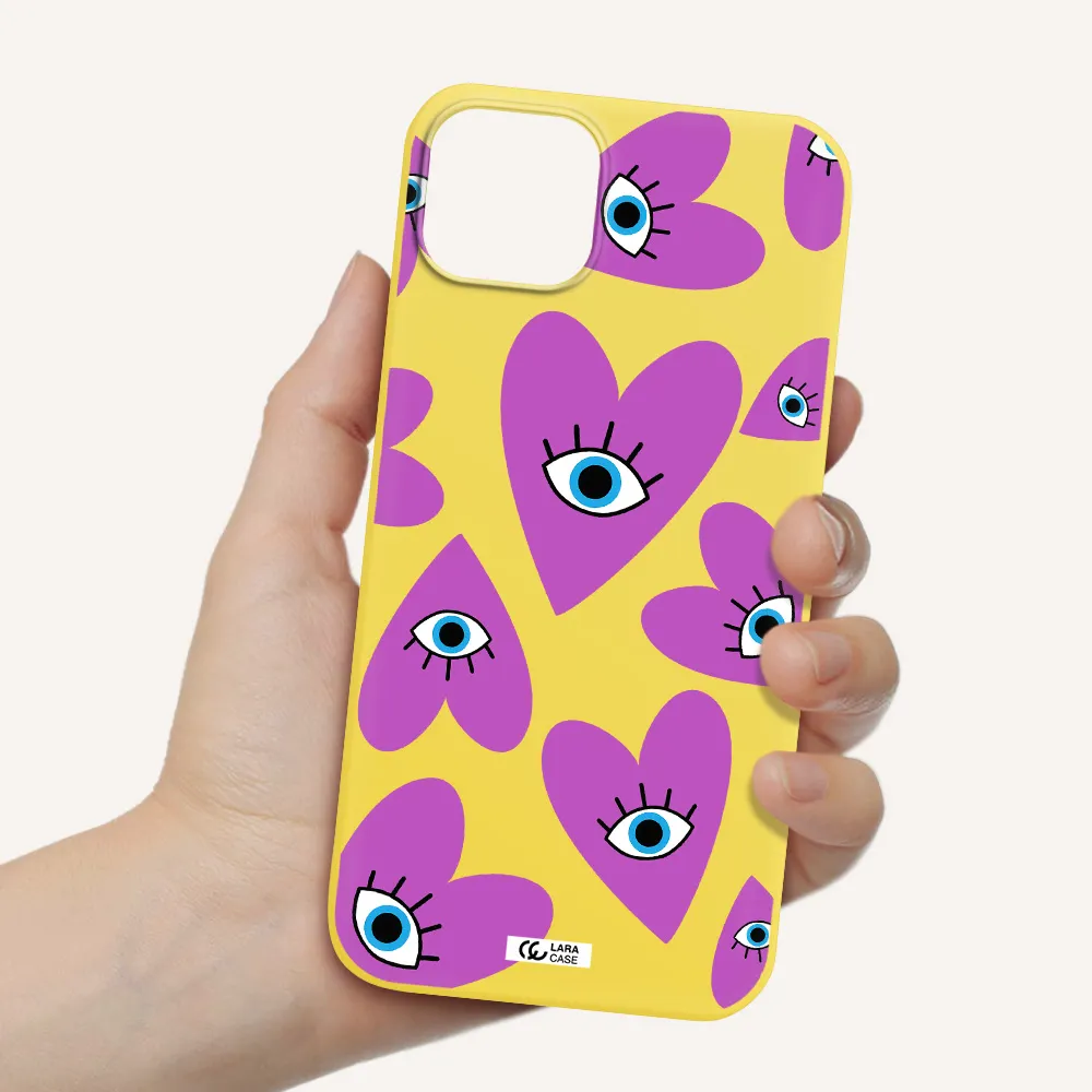 a purple heart with eyes and a black eye Apple iPhone 14 plus Silicone canary yellow Case