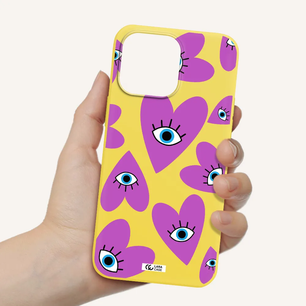 a purple heart with eyes and a black eye Apple iPhone 14 pro Silicone canary yellow Case
