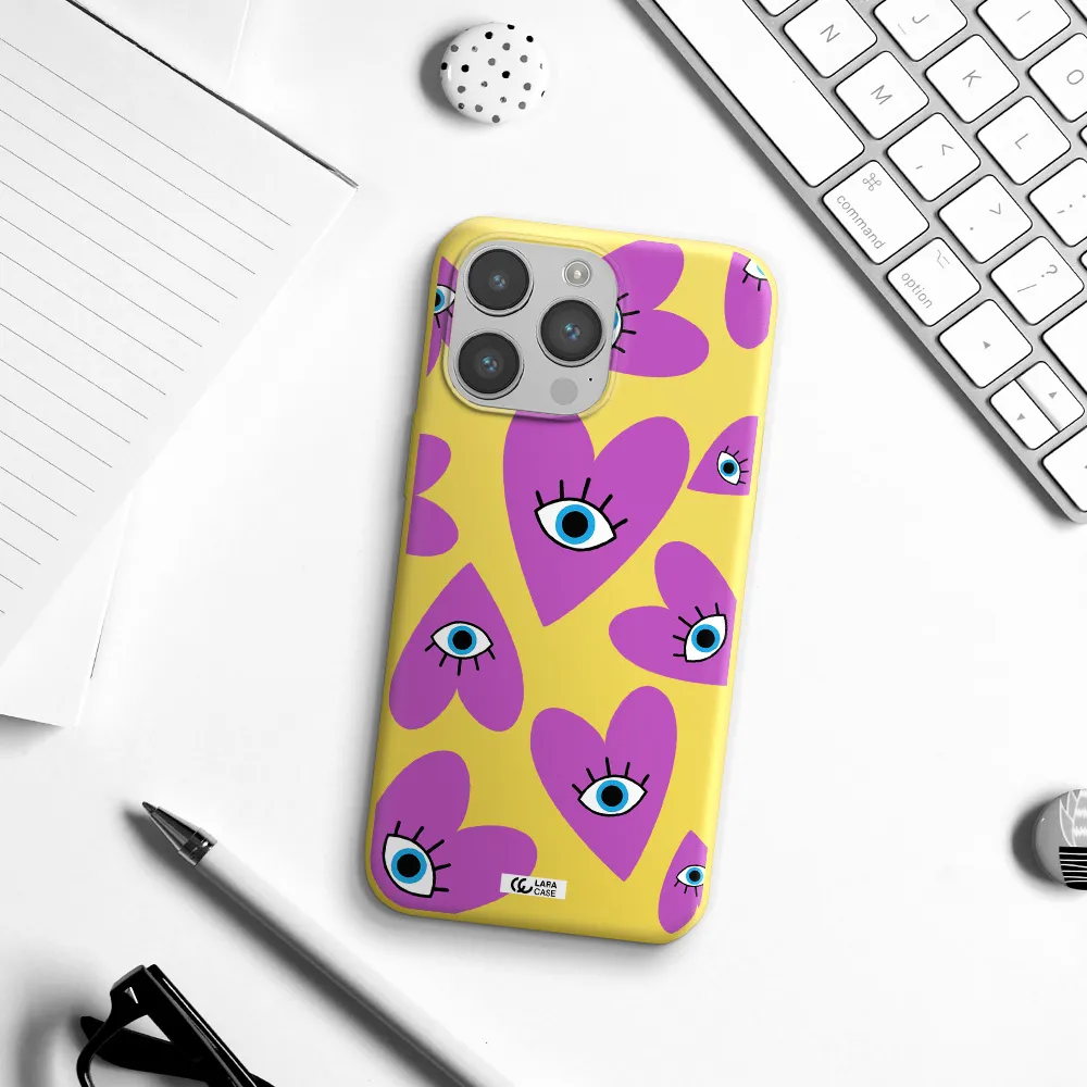 a purple heart with eyes and a black eye Apple iPhone 14 pro Silicone canary yellow Case