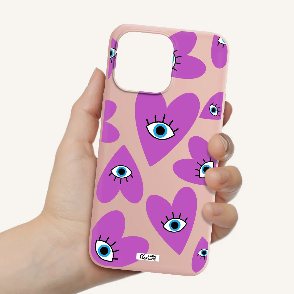a purple heart with eyes and a black eye Apple iPhone 14 pro Silicone pastel pink Case