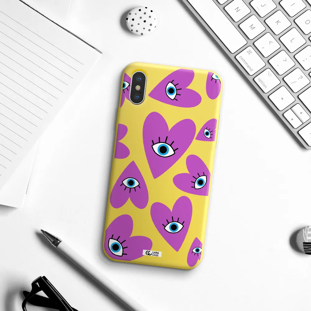 a purple heart with eyes and a black eye Apple iPhone X Silicone canary yellow Case
