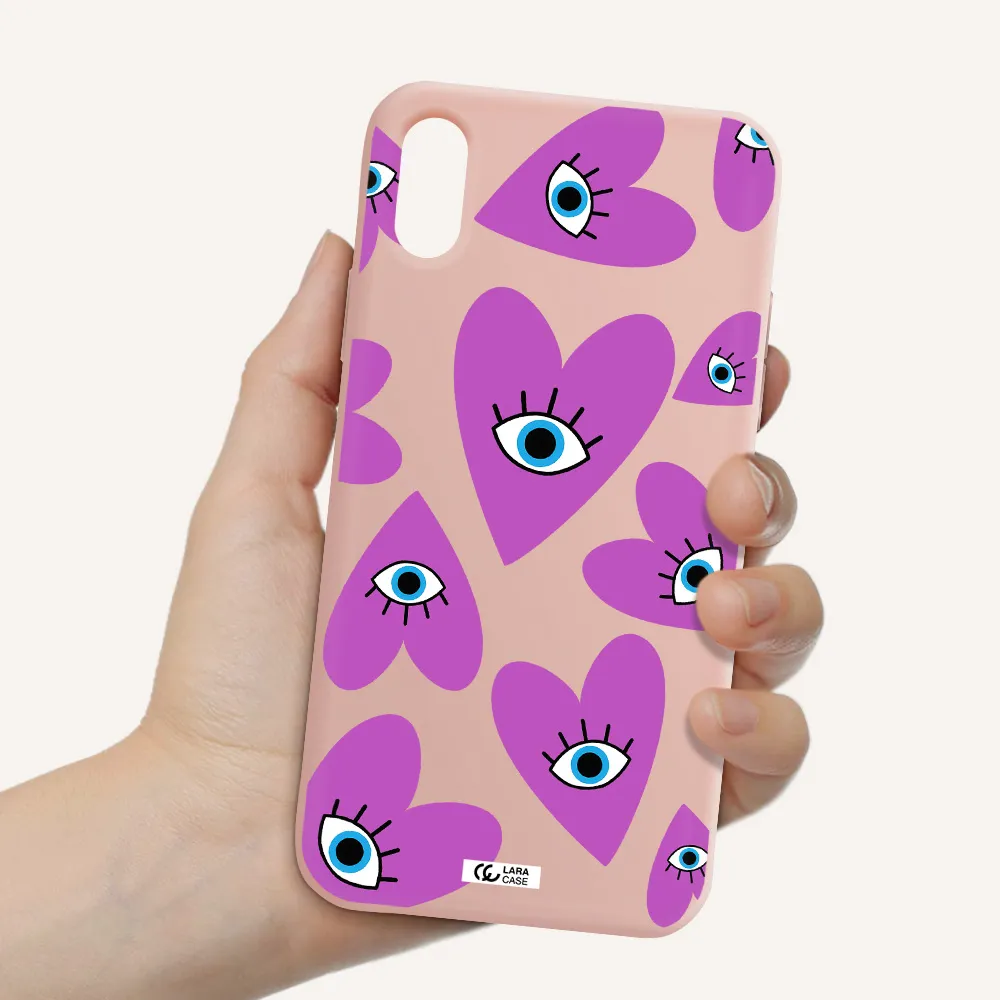 a purple heart with eyes and a black eye Apple iPhone X Silicone pastel pink Case