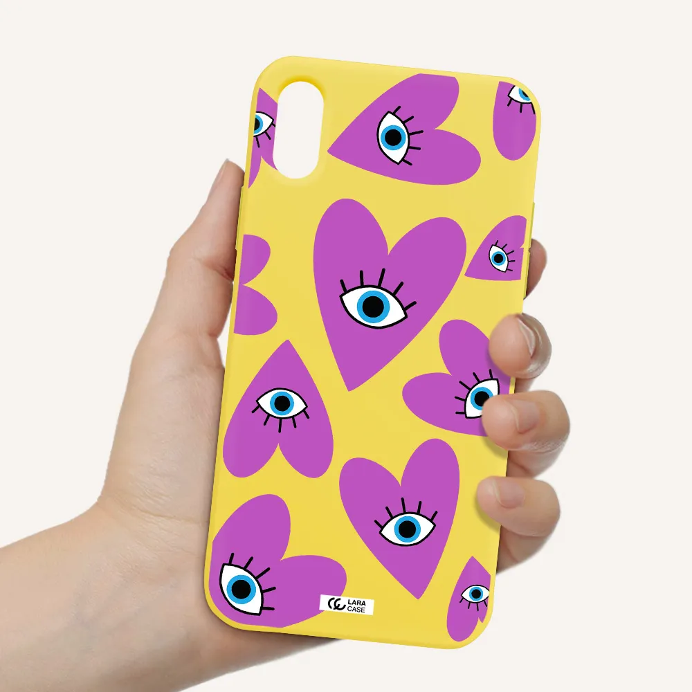 a purple heart with eyes and a black eye Apple iPhone XS Silicone canary yellow Case