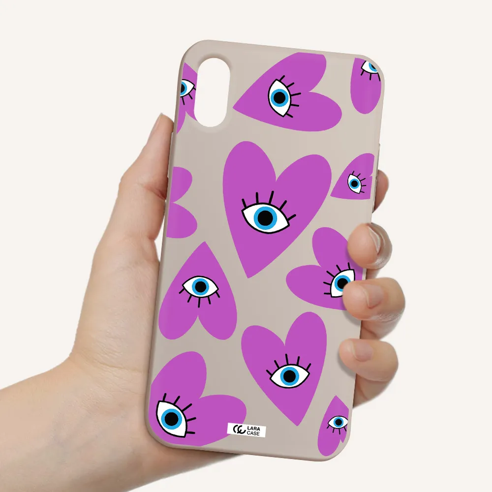 a purple heart with eyes and a black eye Apple iPhone XS Silicone Stone Case