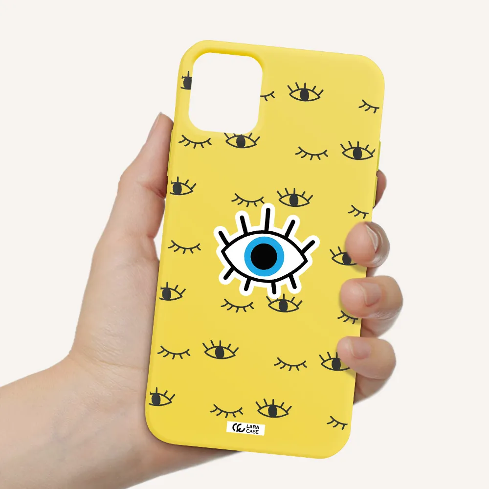 a blue eye with black eyeballs and eyelashes Apple iPhone 11 Silicone canary yellow Case