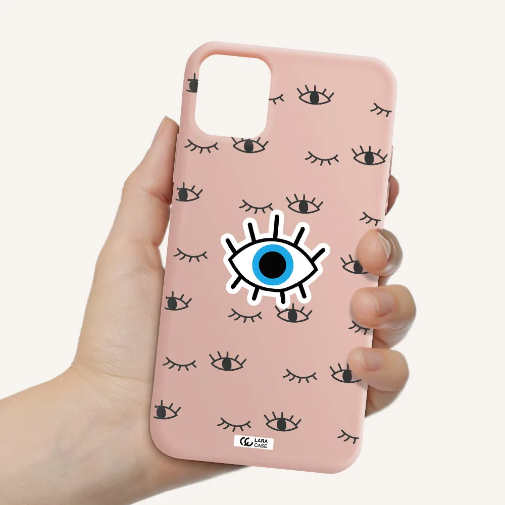 a blue eye with black eyeballs and eyelashes Apple iPhone 11 Silicone pastel pink Case