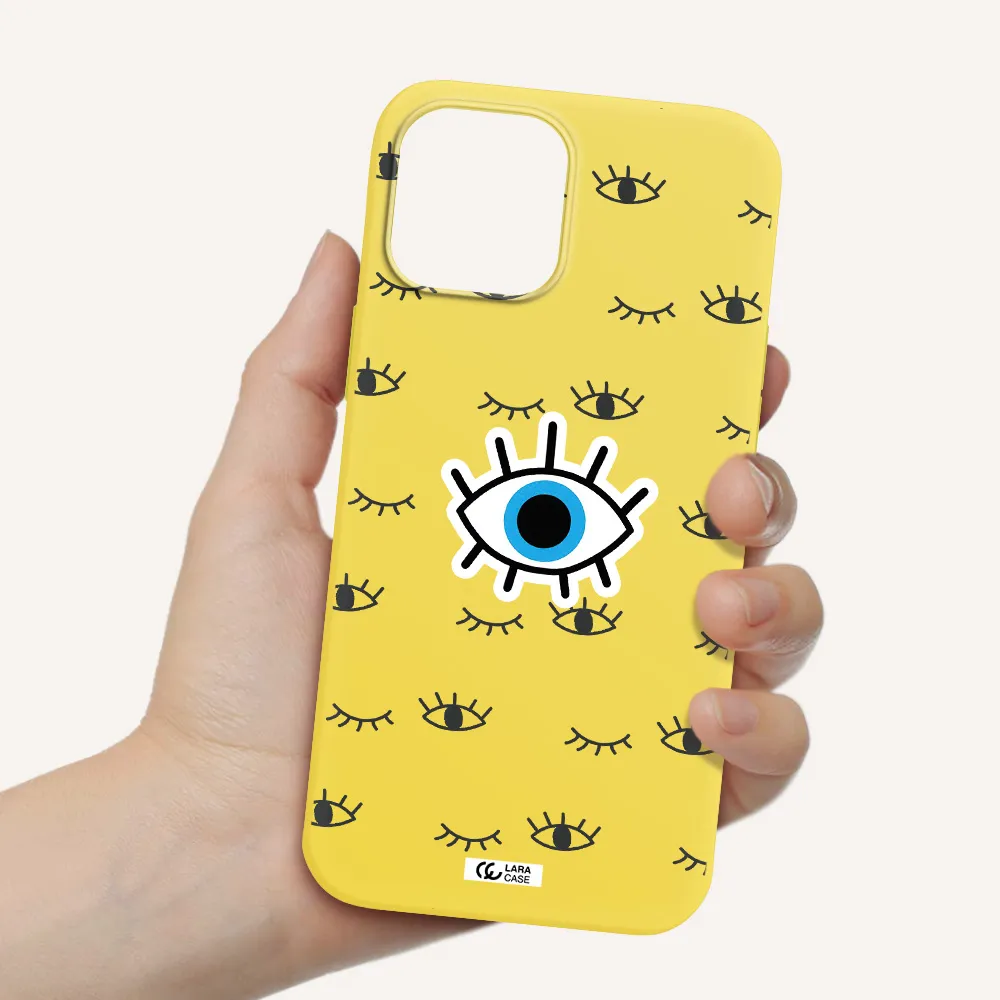a blue eye with black eyeballs and eyelashes Apple iPhone 12 pro max Silicone canary yellow Case