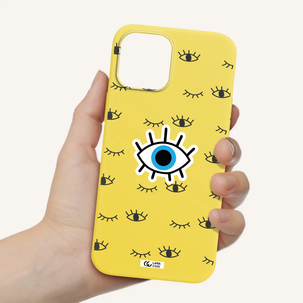 a blue eye with black eyeballs and eyelashes Apple iPhone 12 pro Silicone canary yellow Case