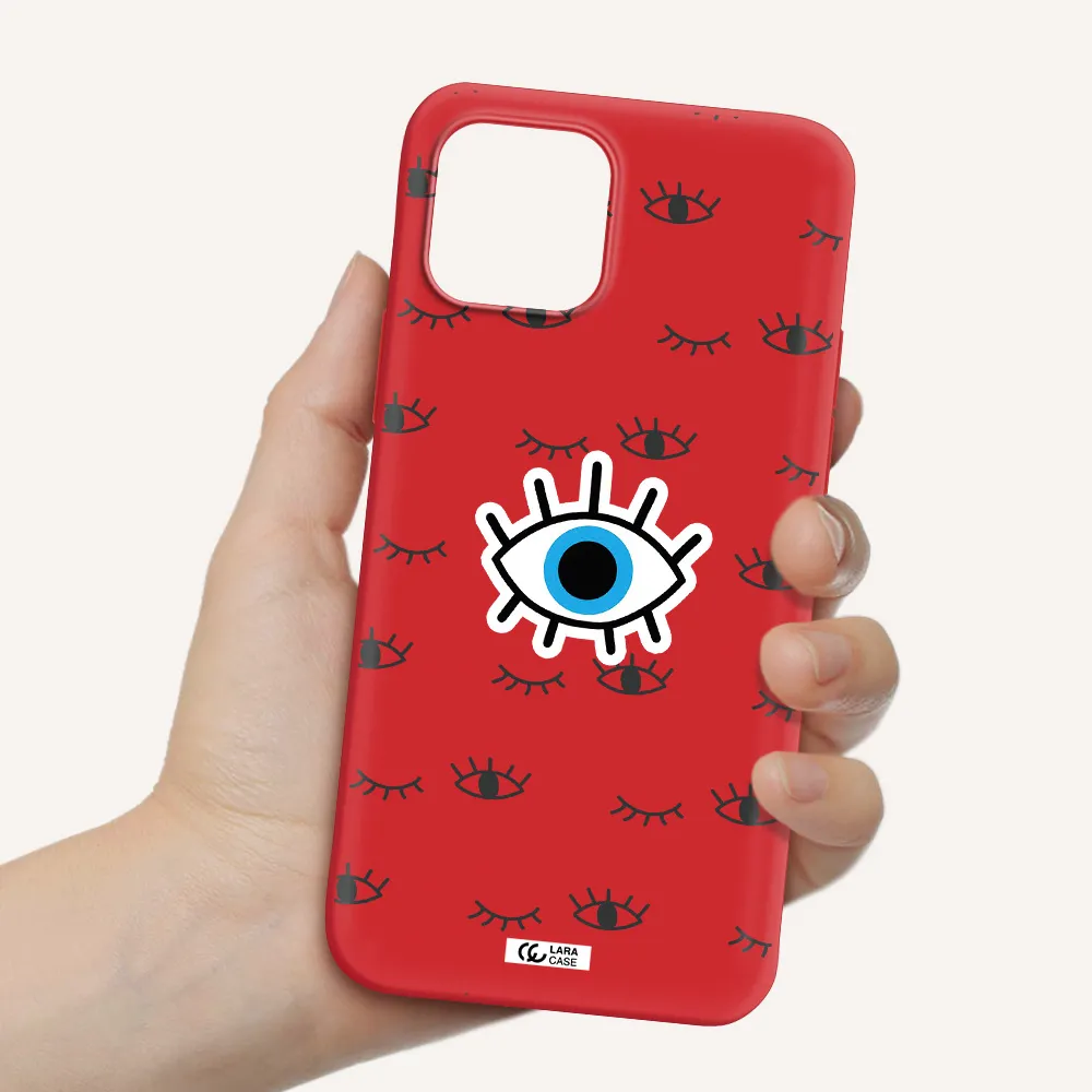 a blue eye with black eyeballs and eyelashes Apple iPhone 12 Silicone Imperial Red Case
