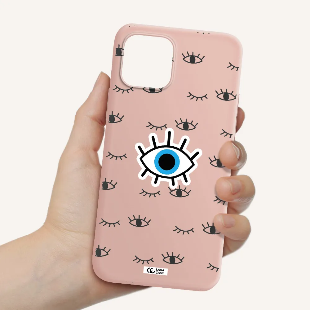 a blue eye with black eyeballs and eyelashes Apple iPhone 12 Silicone pastel pink Case