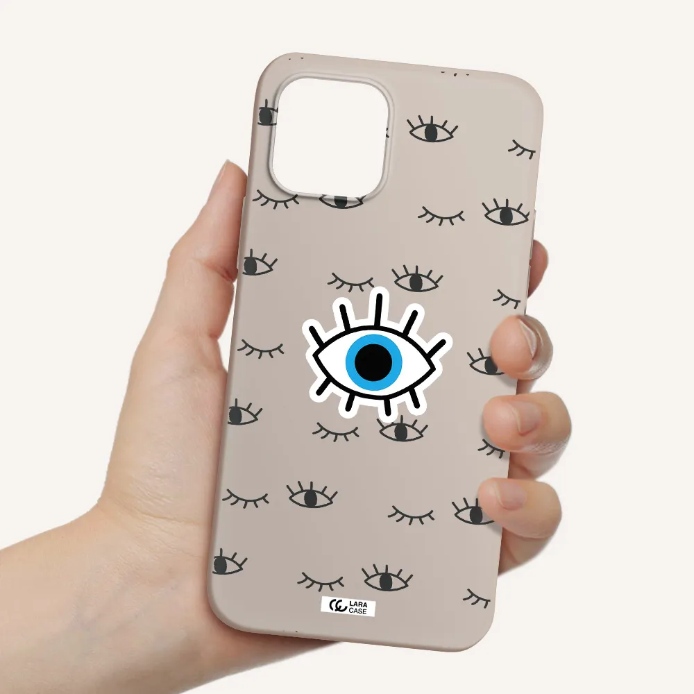 a blue eye with black eyeballs and eyelashes Apple iPhone 12 Silicone Stone Case