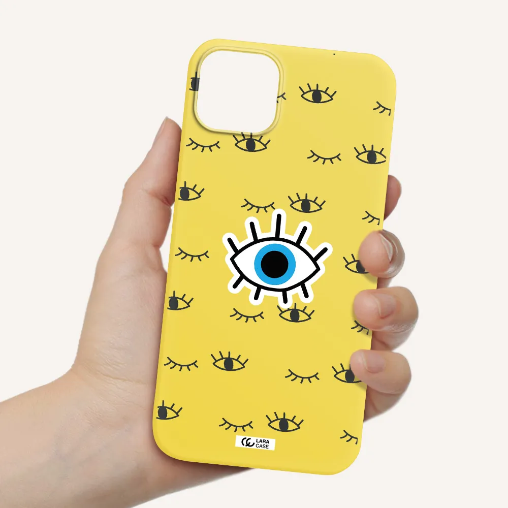 a blue eye with black eyeballs and eyelashes Apple iPhone 14 plus Silicone canary yellow Case