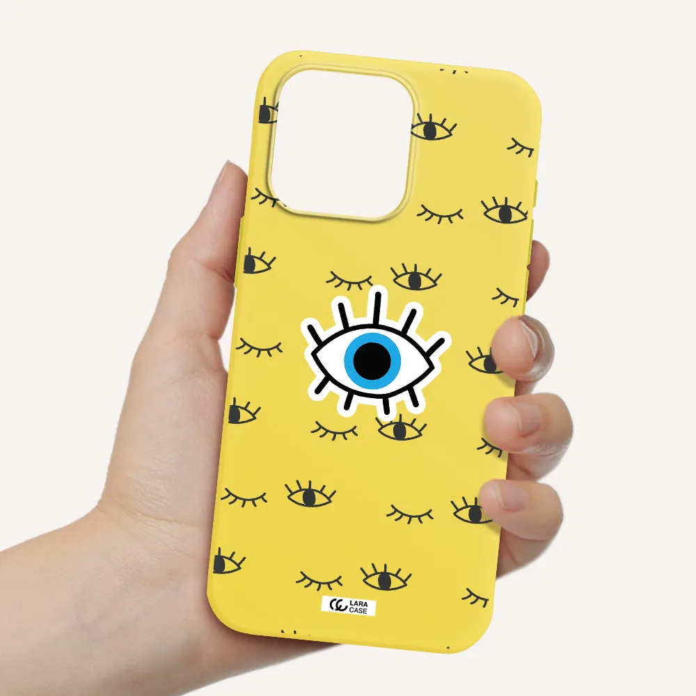 a blue eye with black eyeballs and eyelashes Apple Iphone 15 Pro max Silicone canary yellow Case