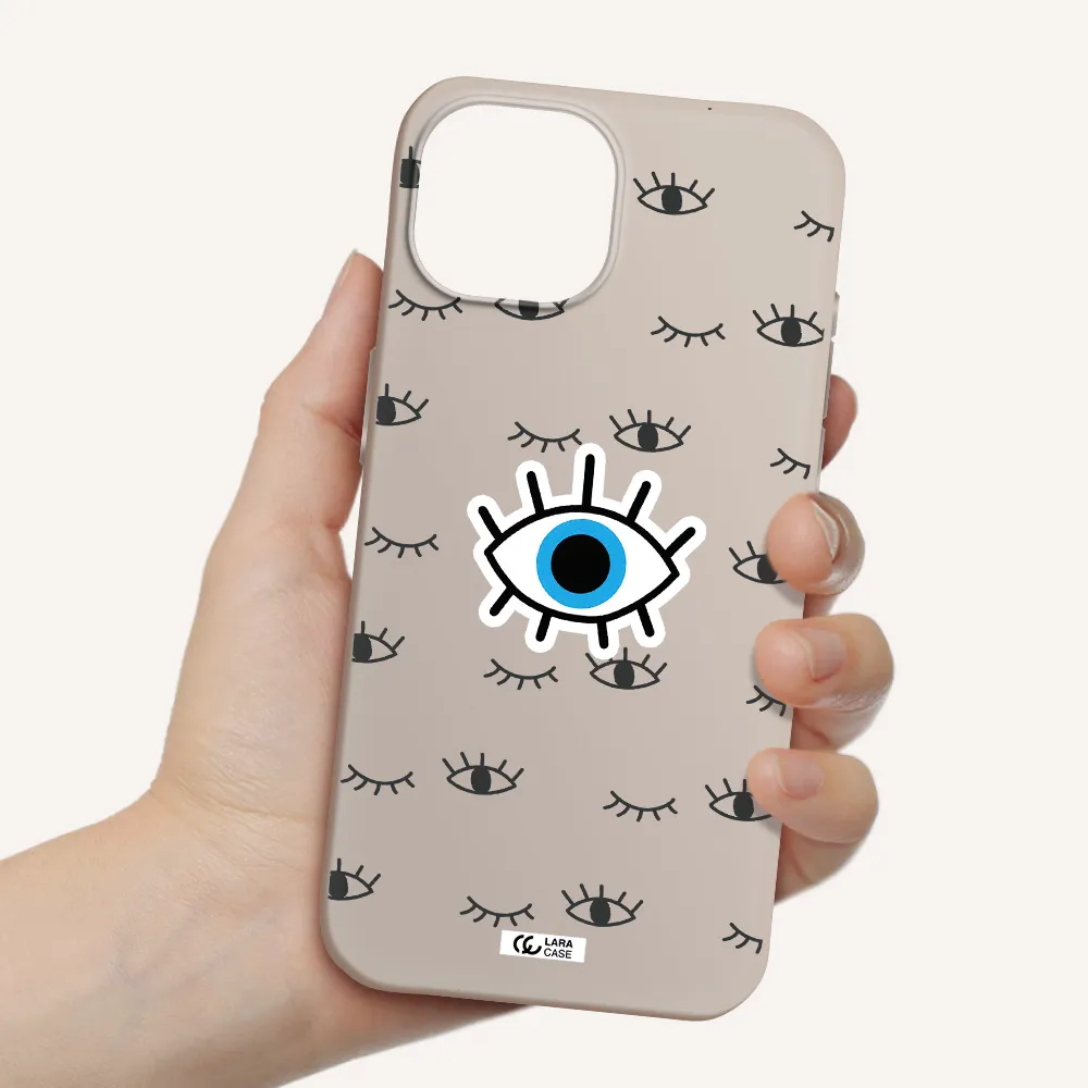 a blue eye with black eyeballs and eyelashes Apple iPhone 15 Silicone Stone Case