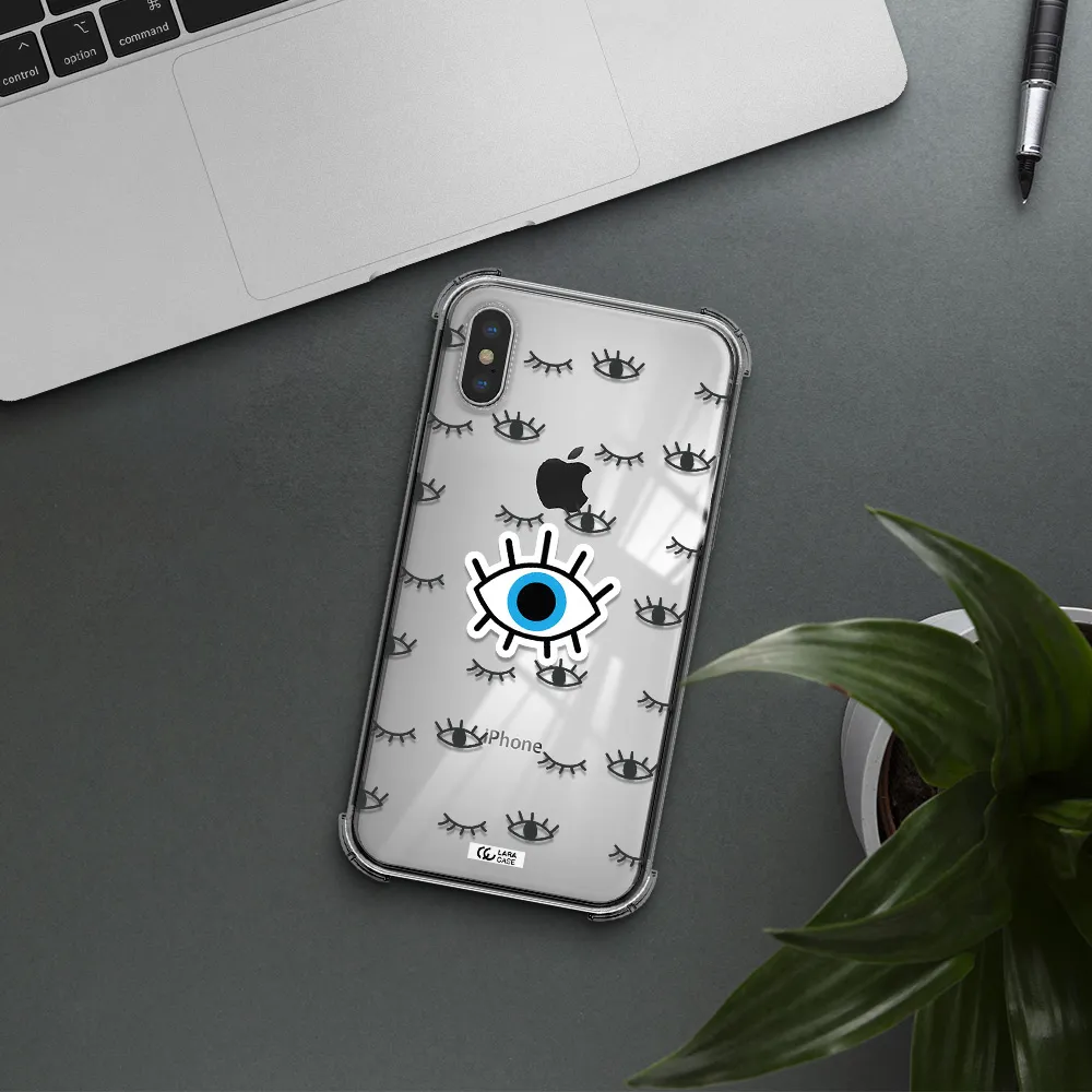 a blue eye with black eyeballs and eyelashes Apple iPhone X Clear PC Case