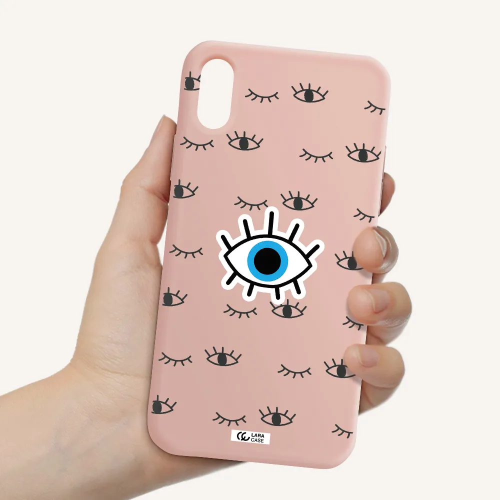 a blue eye with black eyeballs and eyelashes Apple iPhone XS Silicone pastel pink Case