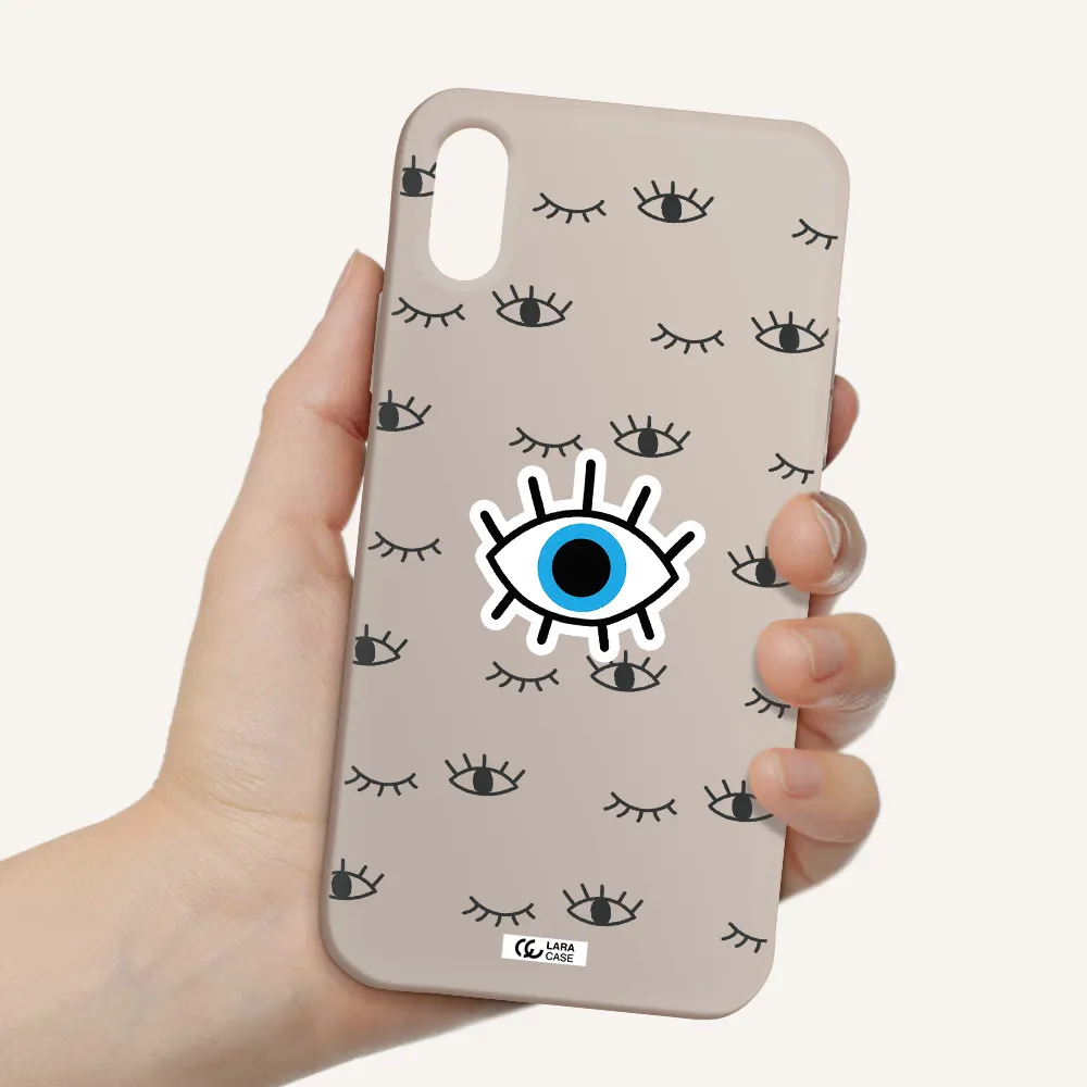 a blue eye with black eyeballs and eyelashes Apple iPhone XS Silicone Stone Case